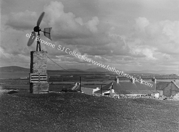 HOME-MADE WINDCHARGER (OLD AEROPLANE PROPELLOR) ERECTED BY FR. P.KILGALLON P.P.